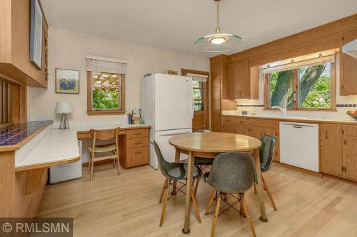 With plenty of room for a table, as well as a counter top and desk area, this kitchen is set up for all kinds of simultaneous activities!