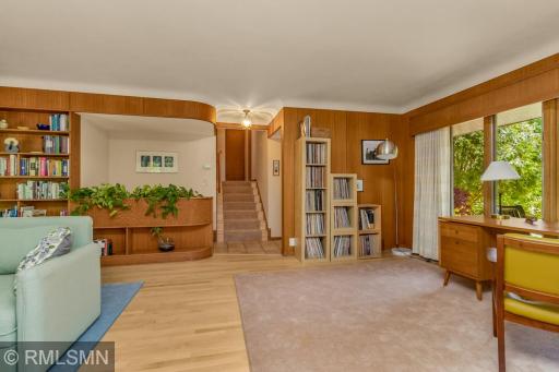 Note the curved mahogany paneling details. The stairs lead to the upper level.