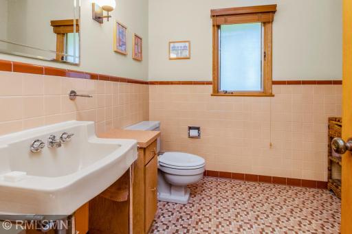 3/4 bathroom off of the primary bedroom, with gorgeous original tile and fixtures.