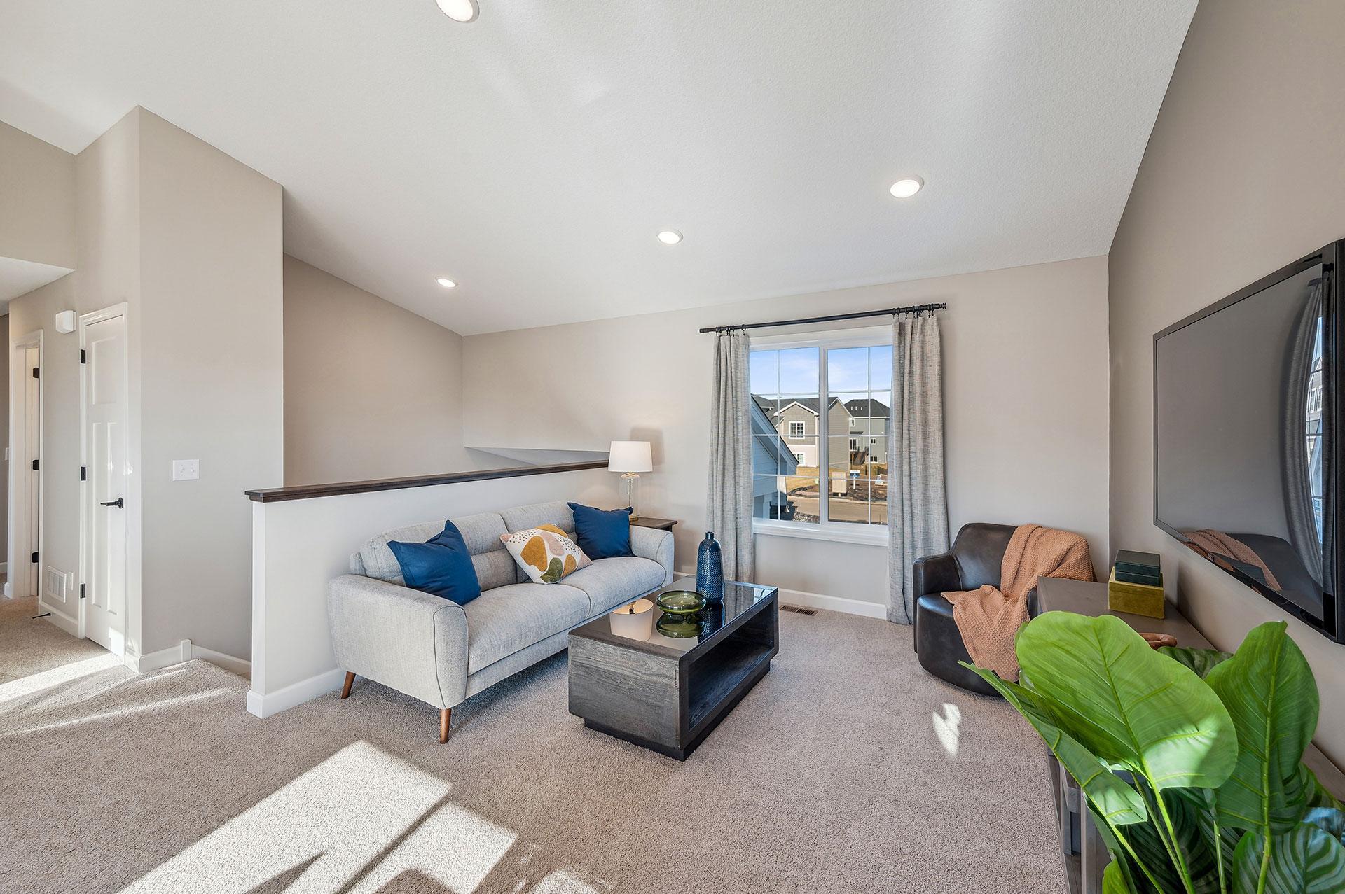 Living Room - photo of a staged model home of the same floorplan. Selections may be different.