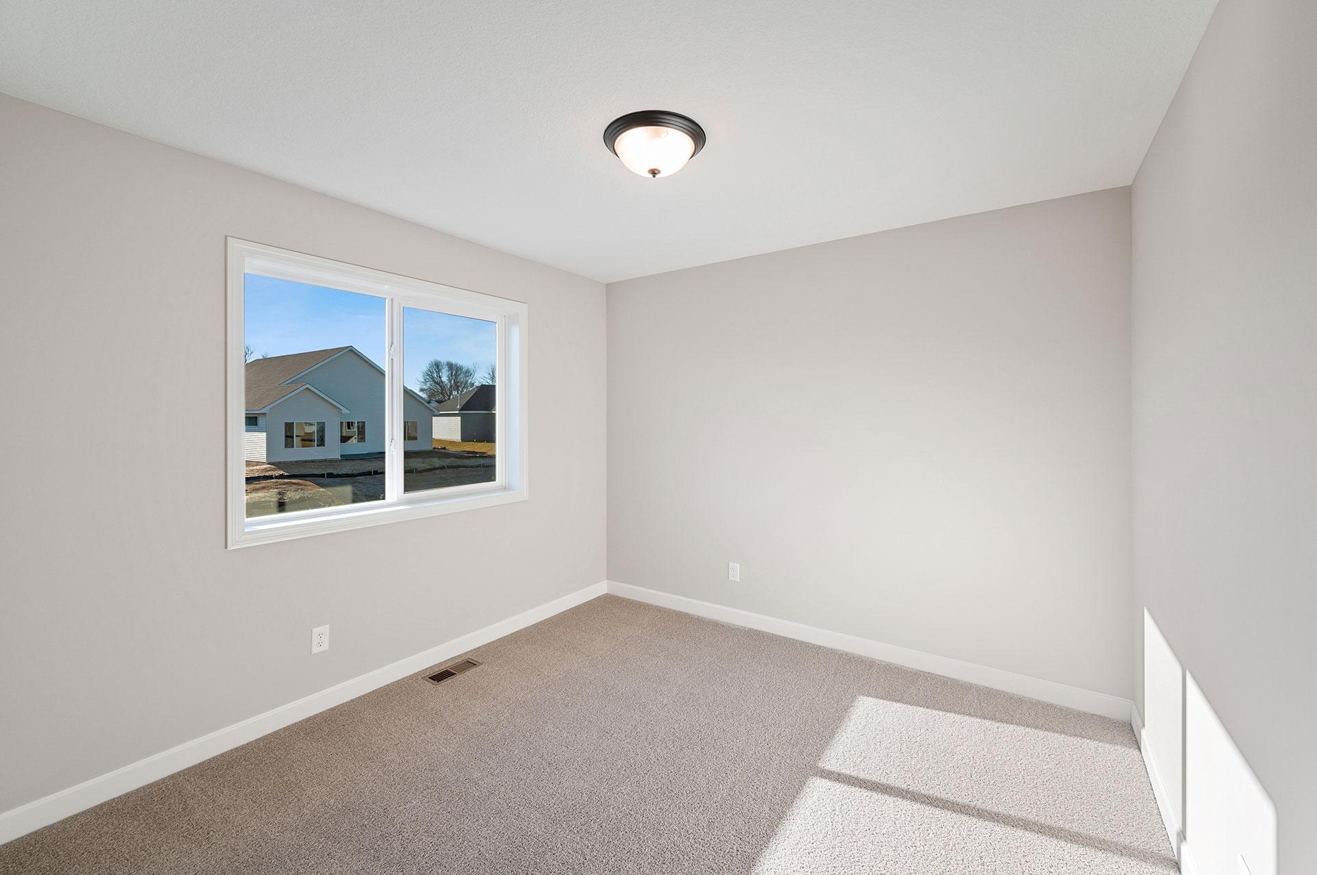 Bedroom - photo of a model home of the same floorplan. Selections may be different.