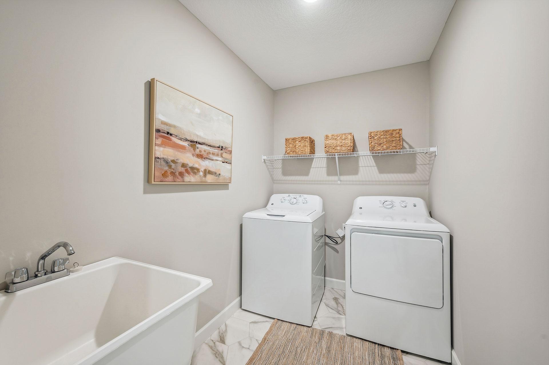 Main Floor Laundry Room - photo of a staged model home of the same floorplan. Selections may be different.