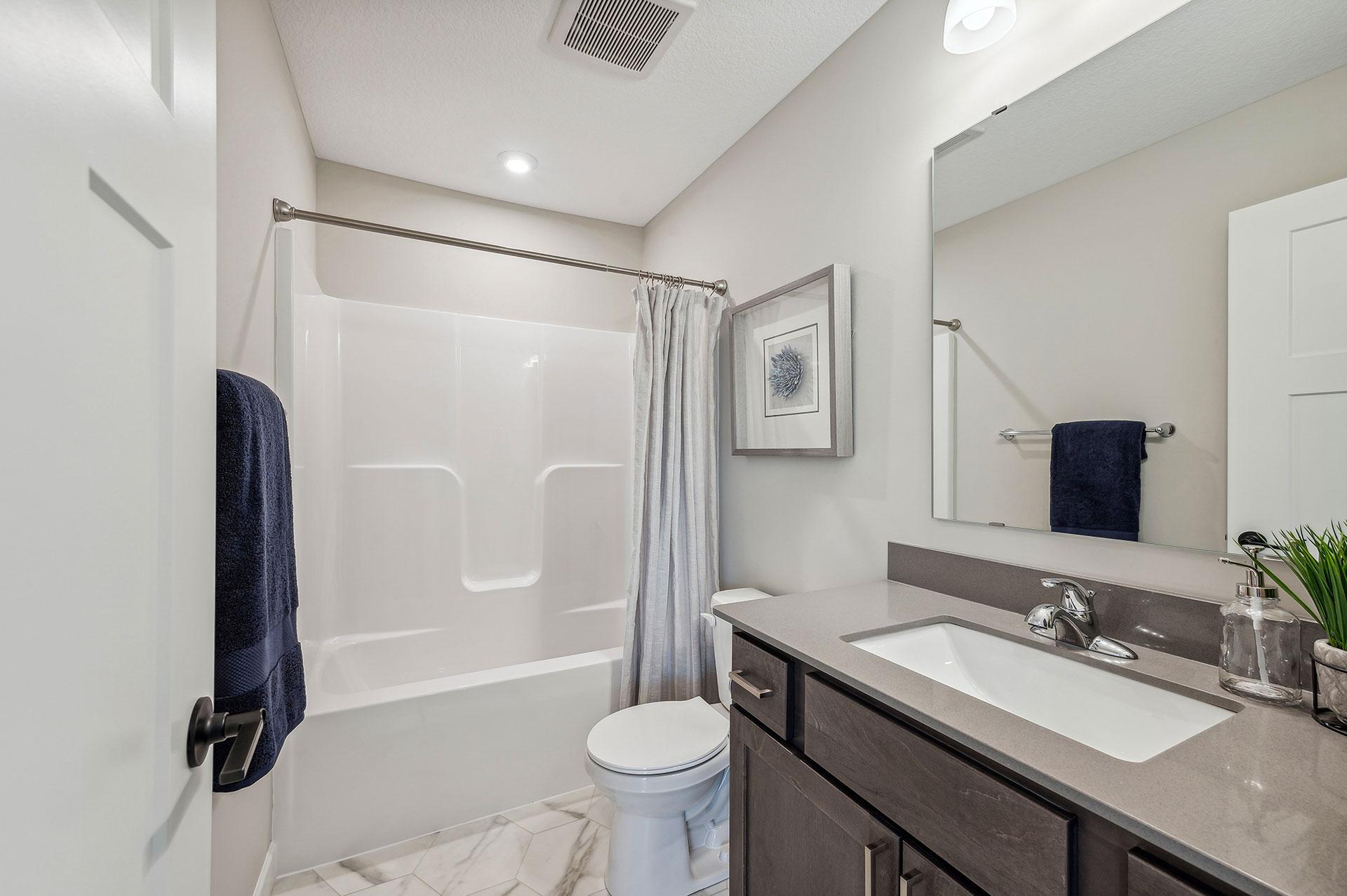 Main Floor Full Bath - photo of a staged model home of the same floorplan. Selections may be different.