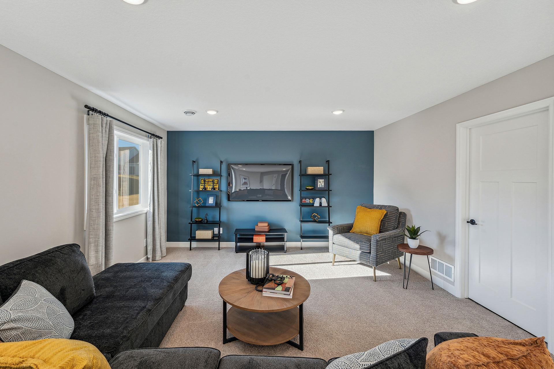 Lower Level Family Room - photo of a staged model home of the same floorplan. Selections may be different.