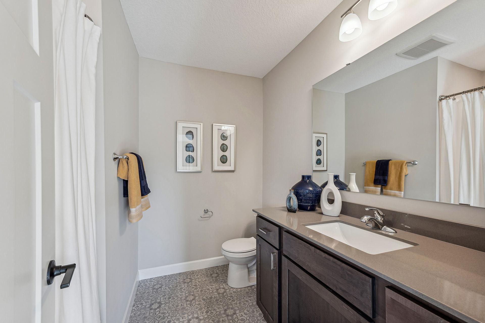Lower Level Bathroom - photo of a staged model home of the same floorplan. Selections may be different.