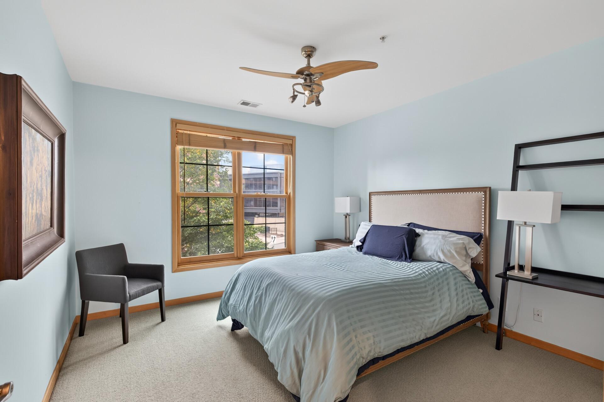 main floor bedroom with walk in closet with built ins
