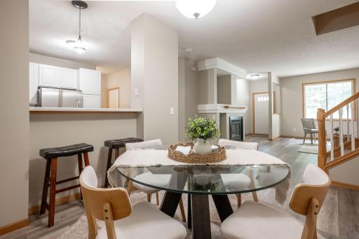 Great flow from Living Room, to Dining Area to Kitchen Bar, to Kitchen and 1/2 bathroom and storage!