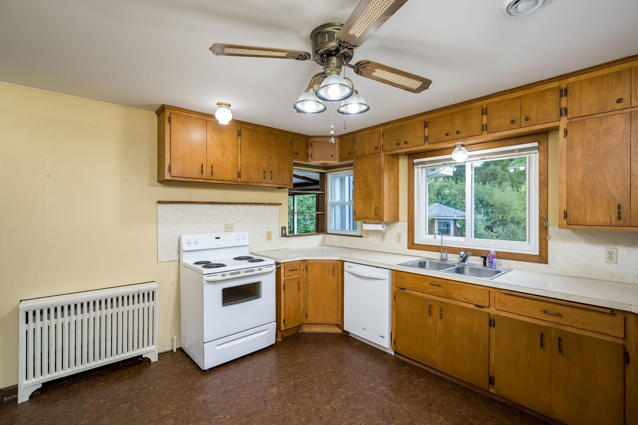 Opening to Family room from kitchen to talk with others while cooking or cleaning up.