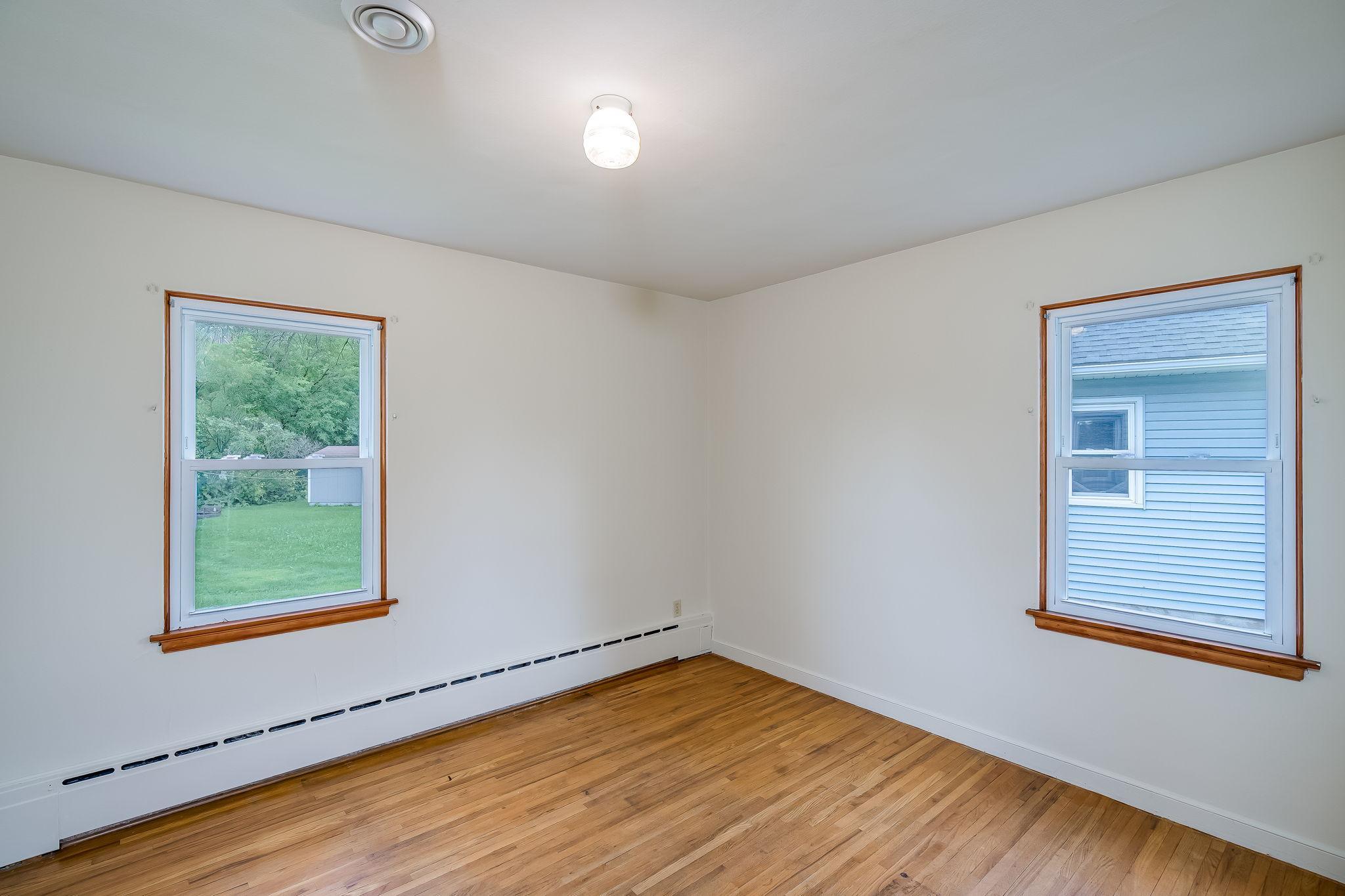 Bedroom with original wood floors and fresh paint