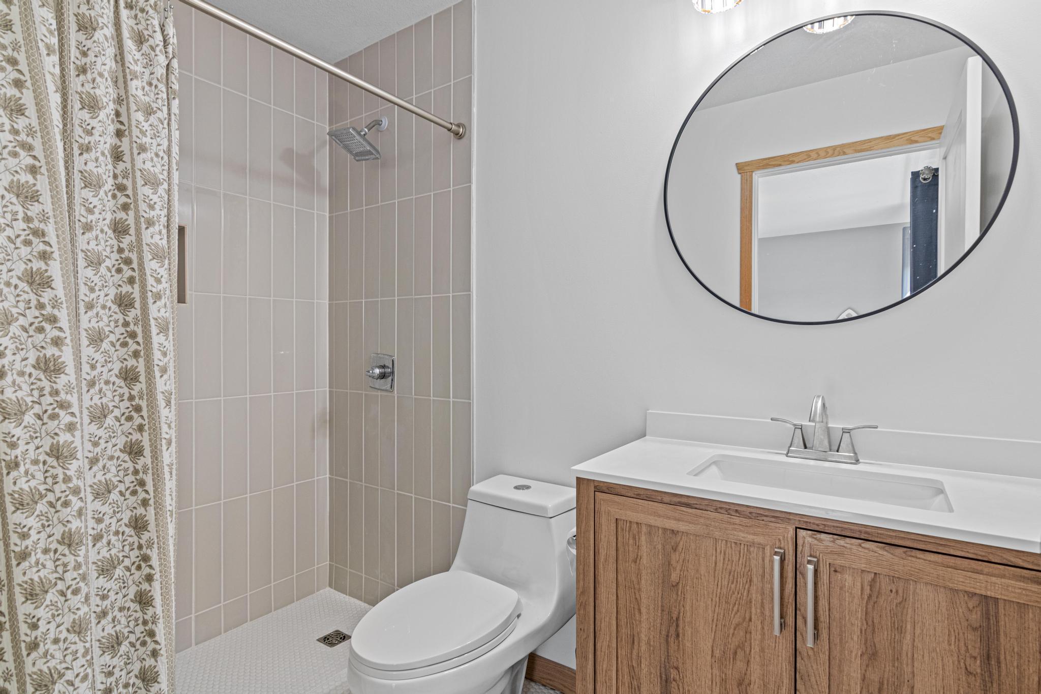 Beautifully updated ensuite with modern style.