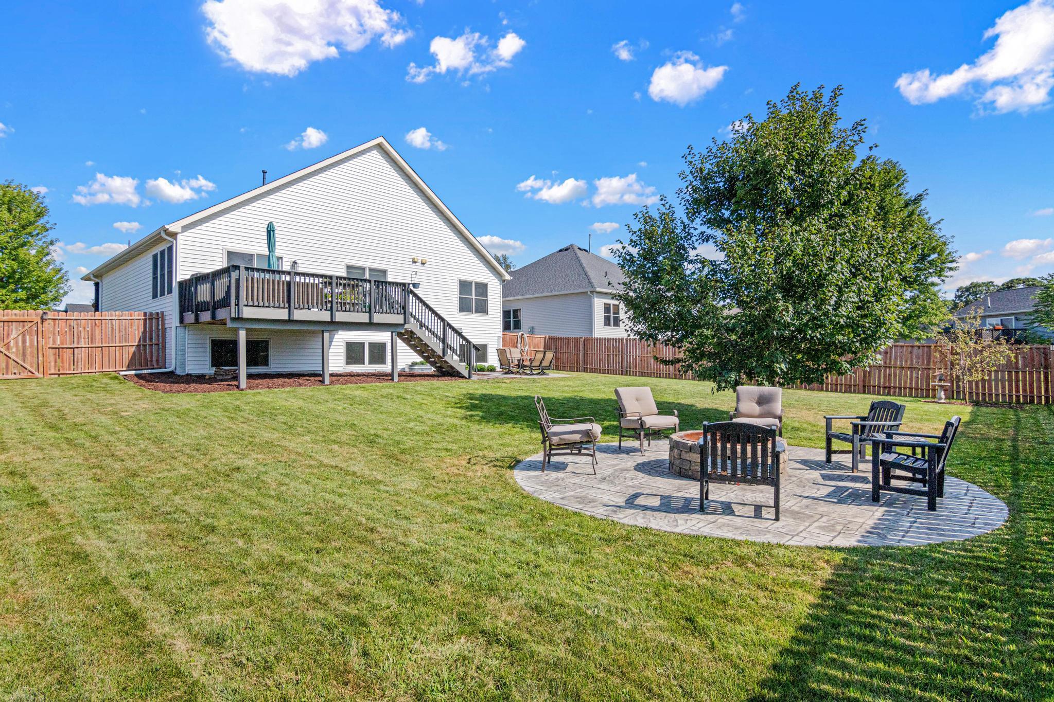 Gather around the fire long after sunset in your fully fenced backyard.