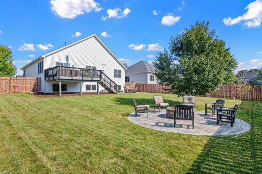 Gather around the fire long after sunset in your fully fenced backyard.