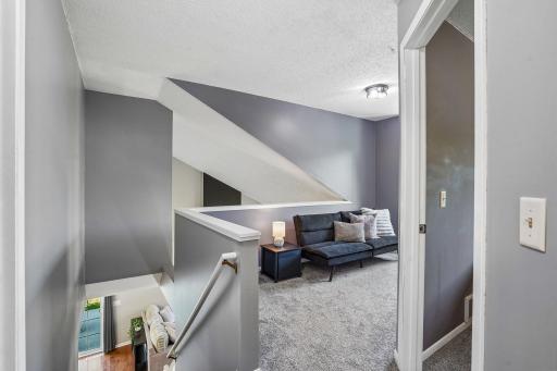 Upper level loft area open to the main level living room.