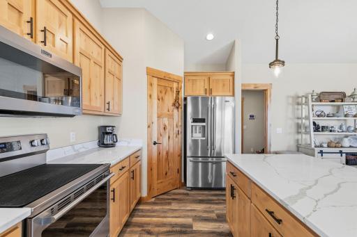 Surprise! See the pantry door next to the refrigerator? -1895 Otter Way New Richmond-11.jpg