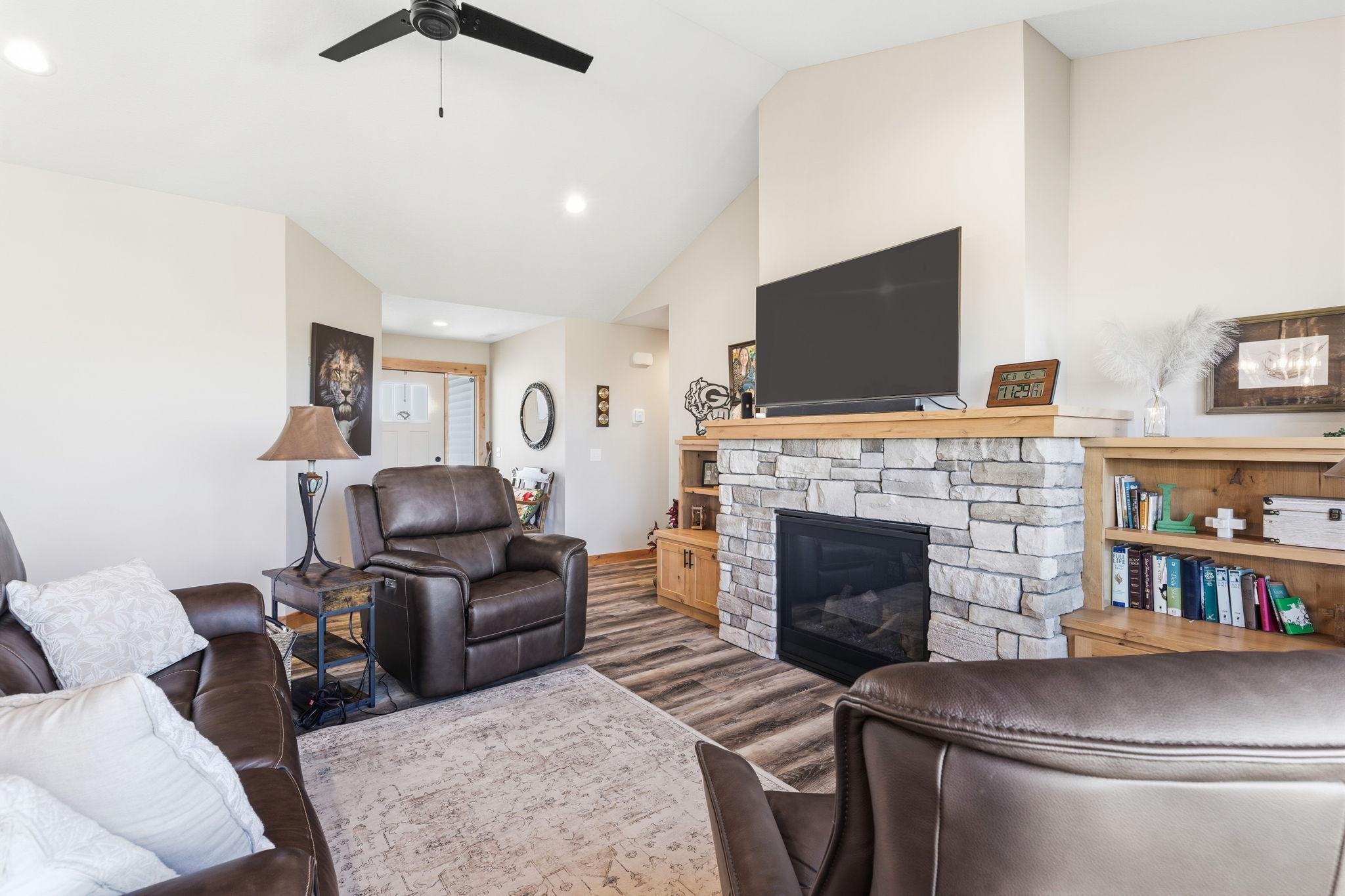The generous entry has a coat closet and large bench and opens to this cozy living room! 1895 Otter Way New Richmond-06.jpg