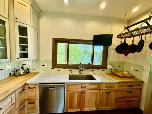Stainless farmhouse sink overlooking the river
