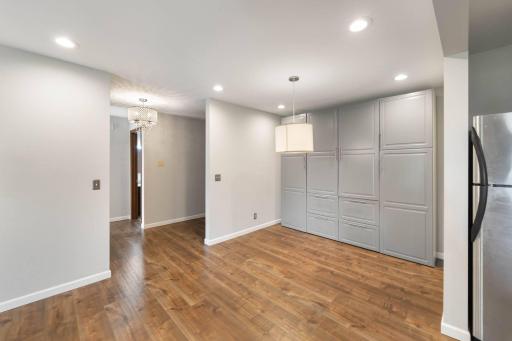 Dining area has storage galore with built-ins along the back wall