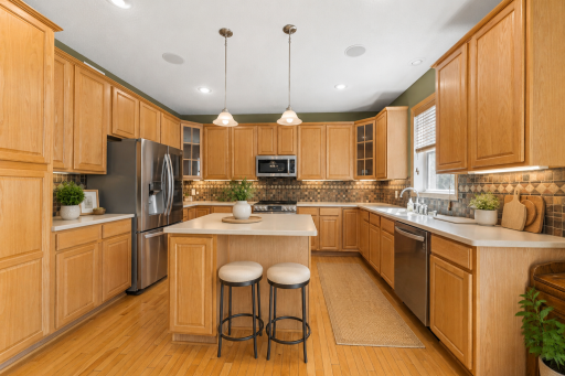 Informal eat in kitchen dining with corian countertops and backsplash