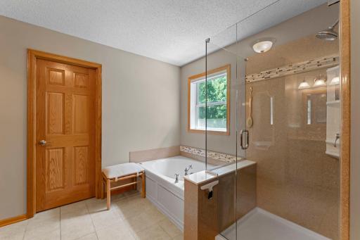 Primary Bath with tile walk in shower, double sinks and privacy potty!