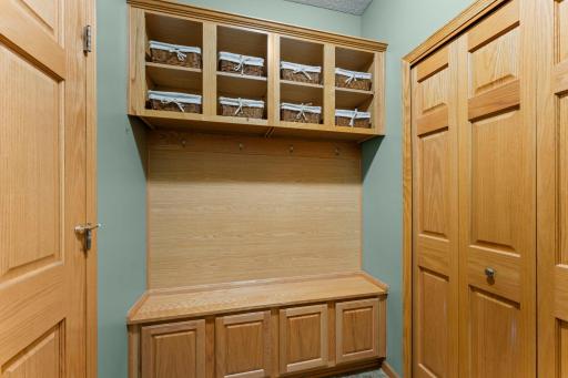 Walk from the OVERSIZED garage to the Convenient Mudroom with custom locker system and roomy closet