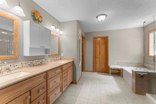 Primary ensuite with double sinks and huge walk in closet