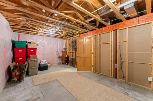 Lower level boasts MORE STORAGE within this thoughtfully designed home