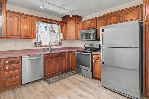 Well-appointed kitchen with generous cabinet and countertop space.