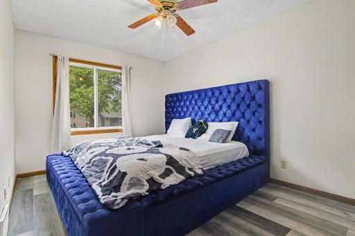 Comfortable main-level bedroom with updated flooring and natural light.