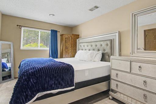Additional lower-level bedroom offering generous space and natural light.