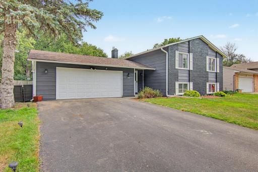 Additional front exterior view featuring the attached two-car garage and freshly painted façade.