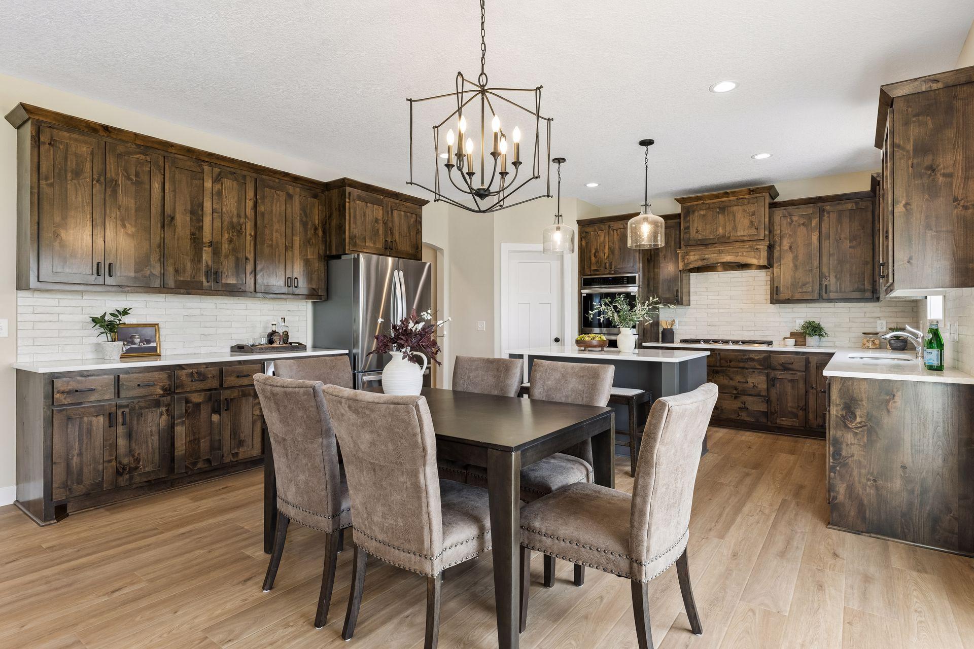 A beautiful open floor plan that brings together the kitchen, dining room, and living room into one inviting space.