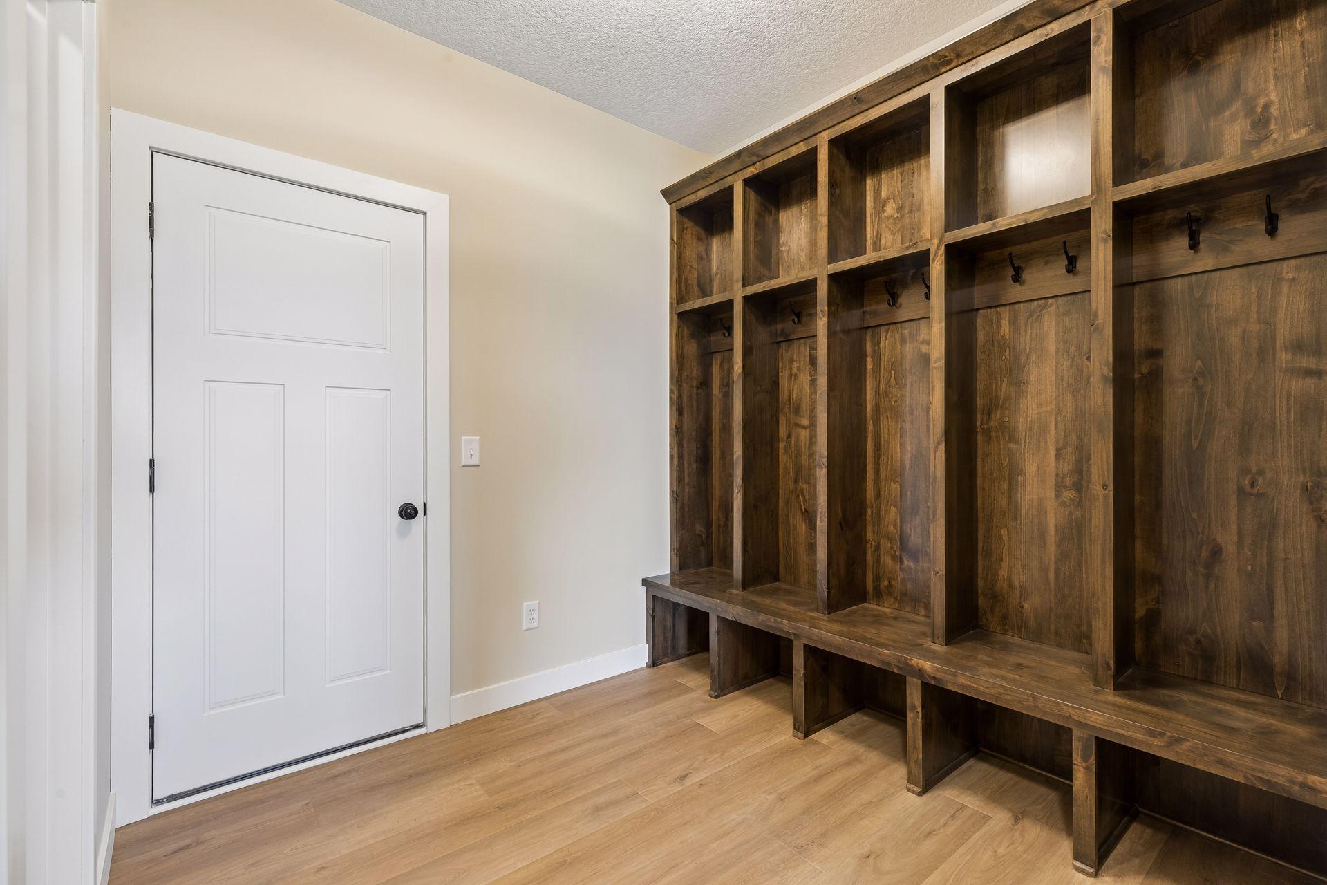Just off the garage entry, you'll find built-in storage and a convenient bench to keep everyday essentials organized.