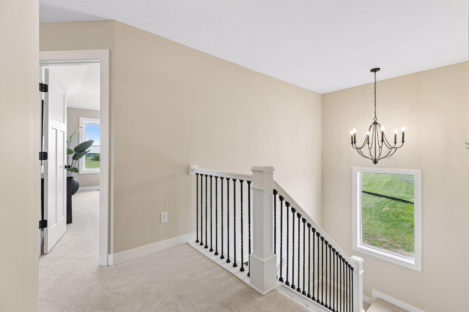 This staircase window allows natural light to flow throughout the home, creating an open, airy feel and turning an often-overlooked space into a beautiful design feature.