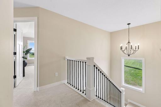 This staircase window allows natural light to flow throughout the home, creating an open, airy feel and turning an often-overlooked space into a beautiful design feature.