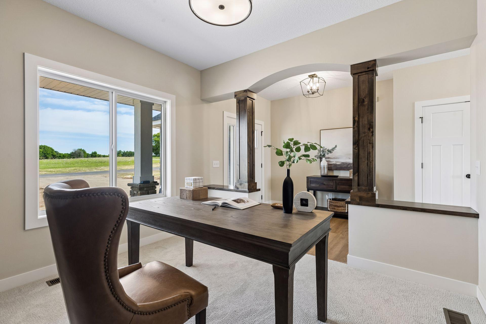 The main level den offers the ideal space for a home office.