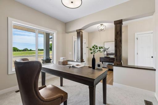 The main level den offers the ideal space for a home office.