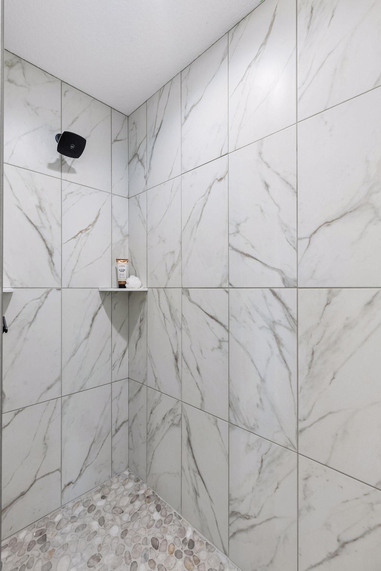 Beautiful tile shower in the private primary bath!