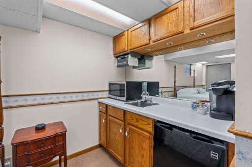 A kitchenette adjoining the fifth bedroom adds true in-law suite or ADU functionality.