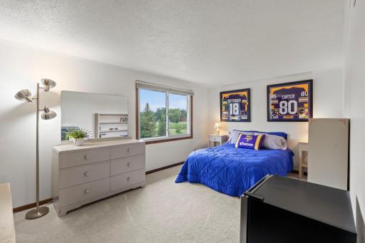 Another generously sized bedroom offers ample natural light and plenty of room for furniture.