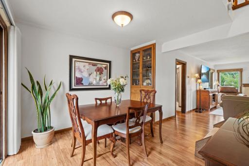 The spacious dining room has a great built-in buffet, and is connected to the living room