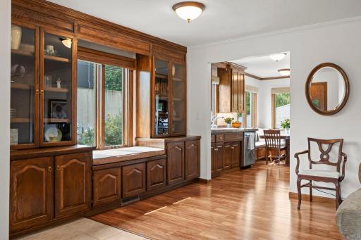 Long sightlines connect the living room to the kitchen, creating the open, generous main-level flow this home is known for.