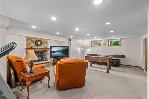 The lower level flows seamlessly between the family room and game area, ideal for movie nights or entertaining.
