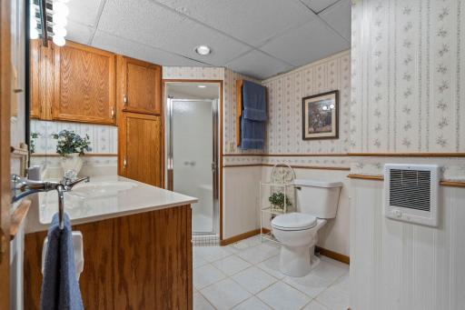 A convenient 3/4 bath on the lower level serves the fifth bedroom and the adjoining rec spaces.