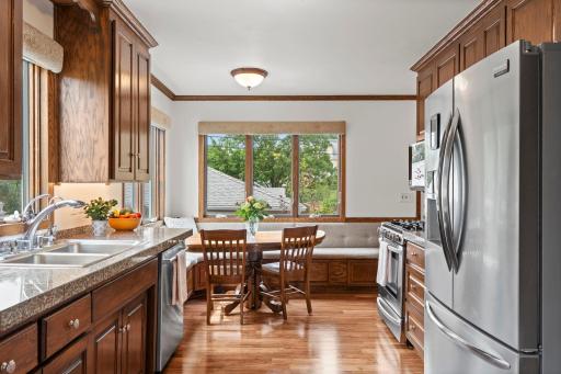 Stainless steel appliances, ample counter space, and a sunny breakfast nook make this kitchen as functional as it is charming.