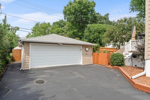 The detached two-car garage, insulated and heated, offers ample parking and workshop space.