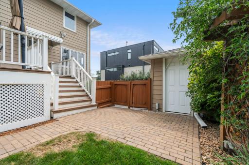 A private walkout door and paver patio give the lower level separate access, ideal for guests or in-law living.
