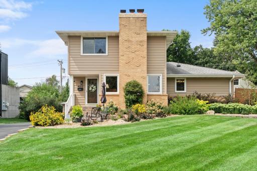 A pristine, sprawling front lawn and inviting entry set the tone for this beautifully maintained Morningside home.