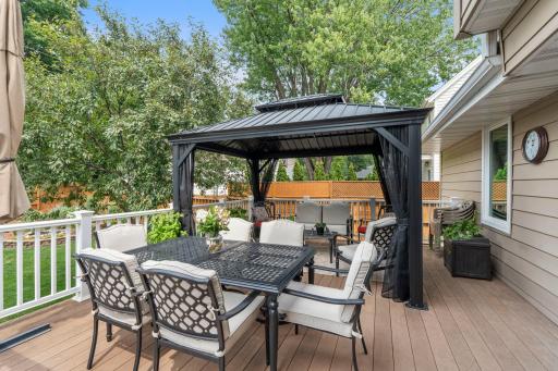 The composite deck's gazebo sitting area is the perfect spot for outdoor dining and relaxing.