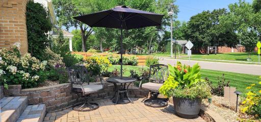 Bistro seating on the front patio looks out toward Weber Park directly across the street, perfect for morning coffee.