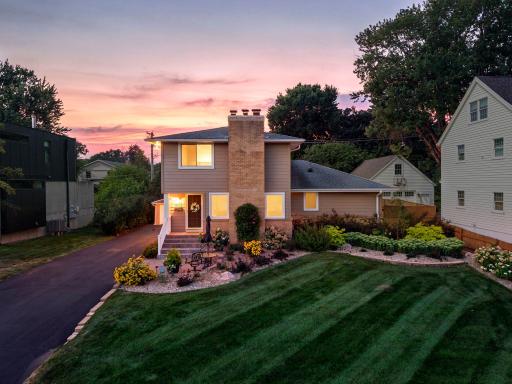 Photo for 4102 Grimes Avenue S, Edina, MN 55416 - listing #7122776 Welcome home! This Morningside classic glows at twilight, showcasing the front paver patio and beautifully landscaped yard.